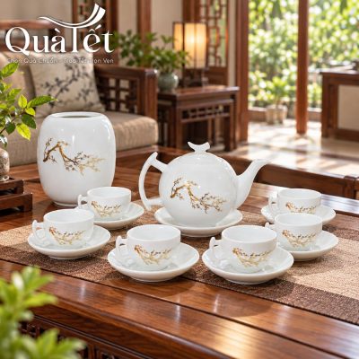 Alternative view of Bộ ấm trà quà tặng Tết men trắng dáng bưởi vẽ vàng cành đào kèm hũ trà QT-AC11